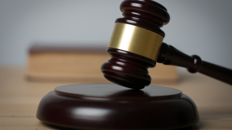 Close up of judge hummer on wooden background.