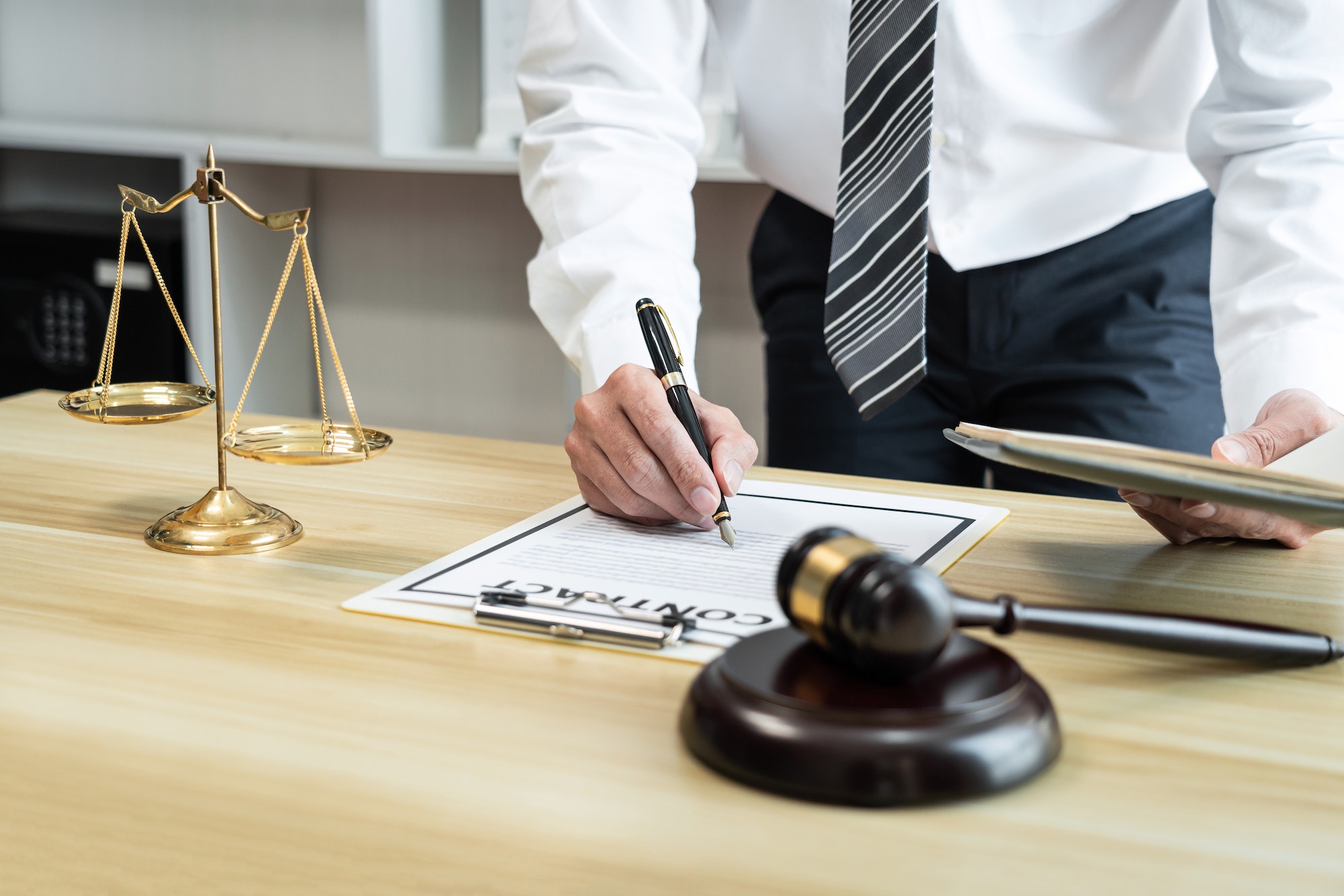 Male lawyer working with litigation contract paper documents of the estate lawsuit